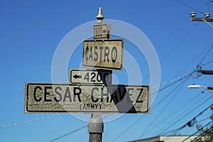 Road sign in the historic districts of san francisco california that says cesar chavez and castro with white and black