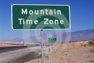 Road sign indicating Mountain Time Zone