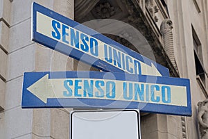 Road sign indicating one way senso unico in both directions photo