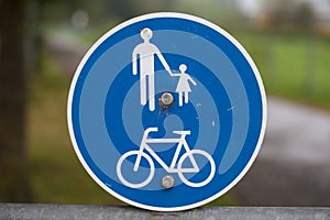 Road sign informing pedestrians and cyclists photo