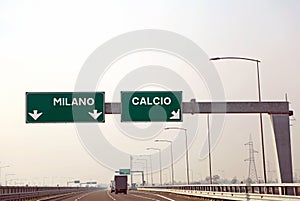 road sign on the Italian motorway for the cities called MILANO a