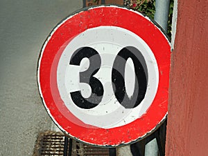 Road sign MAXIMUM SPEED 30 outdoors on sunny day