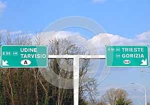 Road Sign in the motorway junction in Northen Italy with crossroad to go to Austria or Slovenia photo