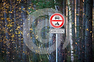 Road sign no entry and additional information sign. Text in Czech language Lesni cesta, in English Forest road