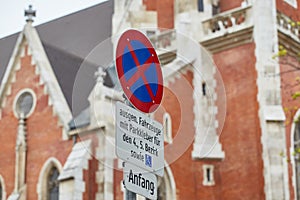 Road sign no parking, in the city on the background of the old cathedral, Viena, Austria photo