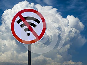 Road sign no wifi on sky background with clouds.