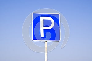 Road sign parking. Sign on a blue sky background.