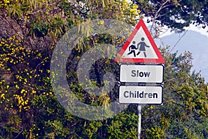 Road sign, pedestrian and slow children with mistake for grammar, joke and comic text for walking in neighborhood