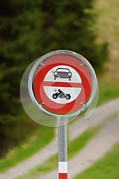 Road sign prohibiting access to cars and motorbikes on walk trail