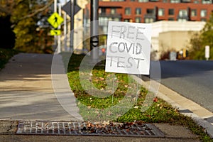 A road sign put by Montgomery County directs residents to a drive through free COVID-19 testing site photo