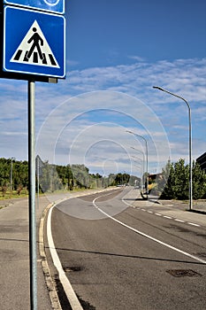 Road with a sign in a residential area in the countryside