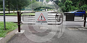 Road sign saying slow down