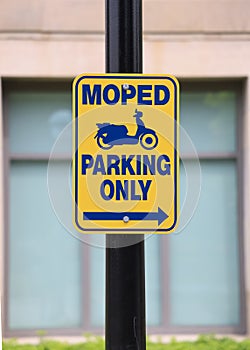 Road sign showing Moped parking direction