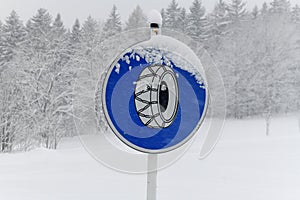 road sign snow chains, Winter in Krkonose mountains, Czech Republic pure white snow,