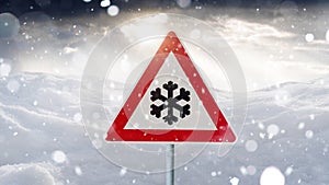 Road sign snow warns of snow and ice in winter, warning sign