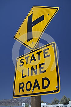 Road sign `State Line Road`