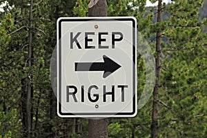 Road sign stating KEEP RIGHT photo