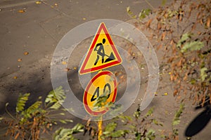 Road sign and symbol. Traffic sign on the background of the street. Road signs. Road repair and speed limit for cars. Driver