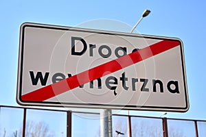 Road sign with text: end of internal road koniec drogi wewnetrznej photo