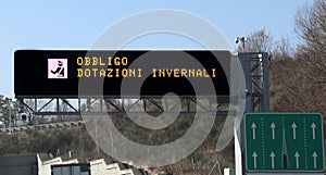 road sign with text that means winter equipment obligation in It photo