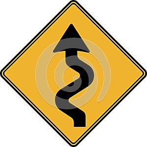Road sign, there is a winding road ahead.
