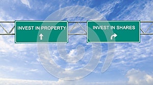 Road sign to investment in Share and property