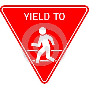 A road sign to yield to a pedestrian.