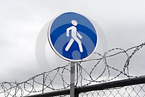 Road sign walkway and barbed wire fence. concept