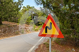 Road sign warning of a bend