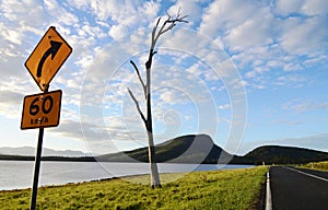 Road sign warning people of bendy roads ahead