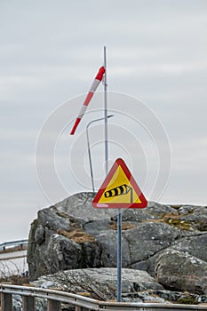 Road sign warning for strong winds..