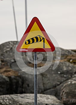 Road sign warning for strong winds..