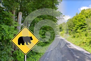 The road sign warns about bears