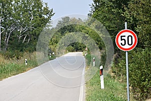 Road sign that warns the drivers that maximum speed is 50 kilometres per hour