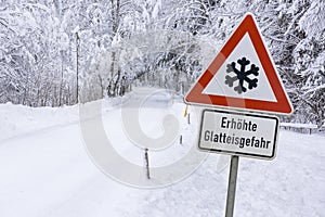 Road sign warns of ice and snow