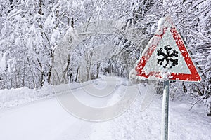 Road sign warns of ice and snow