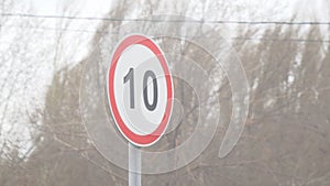 Road sign waving wind