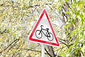 Road sign which shows the bike. The sign stands photo