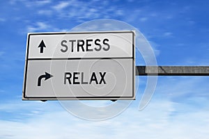 Road sign with words stress and relax. White two street signs with arrow on metal pole on blue sky background