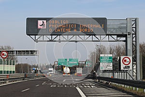 Road signal on Italian language that means Obligation winter equ photo