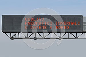 Road signal on Italian language that means Obligation winter equ photo