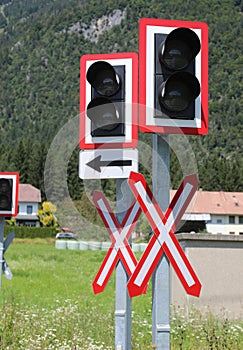 road signs of attention to the train level crossing on the rails of the railway