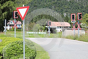 road signs of attention to the train level crossing on the rails of the railway