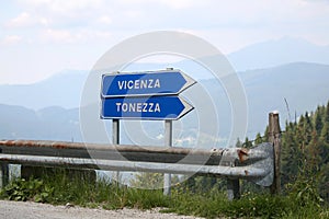 Road signs with direction to Vicenza and Tonezza in Italy