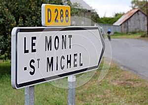 road signs with directions to the abbey of Mont Saint Michel in