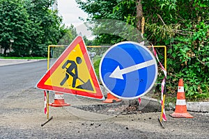 Road signs indicating repair and detour of the site