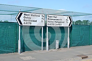 Road signs for right and left directions on the A4178 in Watford, Hertfordshire