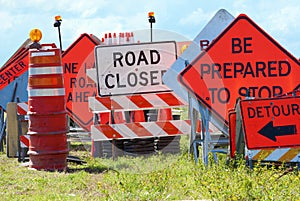 Road signs stacked by road montage