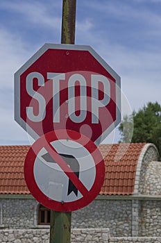 Road signs `Stop sign` and `No left turn` Greece