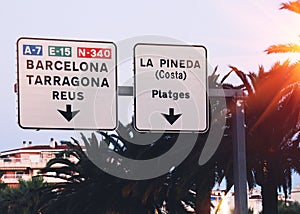 Road signs to Barcelona, La Pineda, Tarragona and Reus